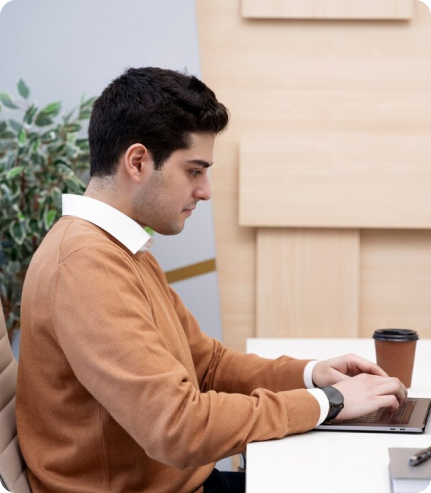 Writer reviewing an article draft on a laptop