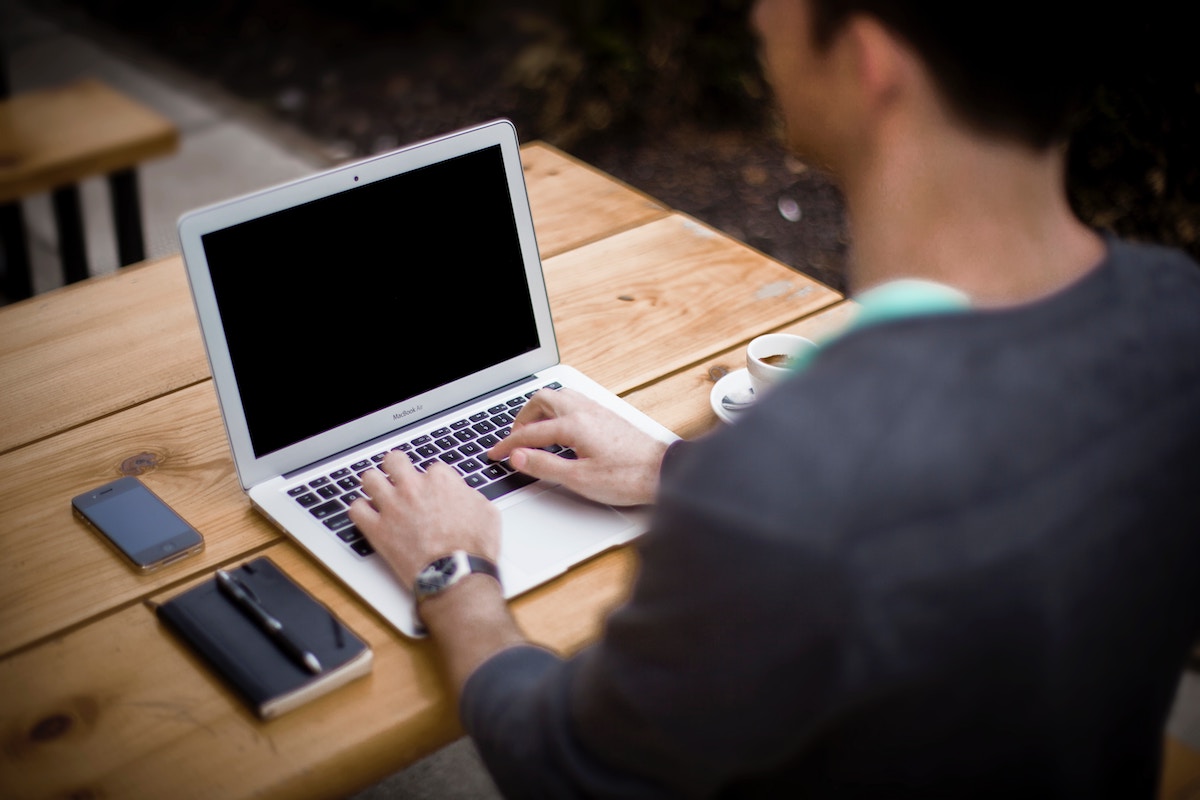 SEO content writer planning an article on a laptop